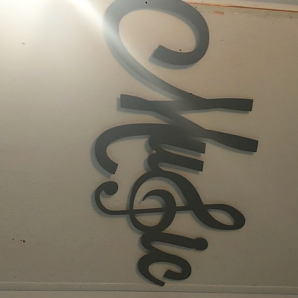 I am selling a black music sign 23in. Wide 13 inches long